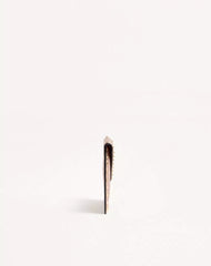 Rockstud Laminated Grainy Calfskin Clutch Bag
