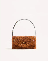 Valentino Garavani Devain Small Shoulder Bag In Lamb Fur With Rhinestones.