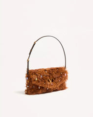 Valentino Garavani Devain Small Shoulder Bag In Lamb Fur With Rhinestones.