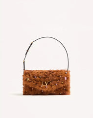 Valentino Garavani Devain Small Shoulder Bag In Lamb Fur With Rhinestones.